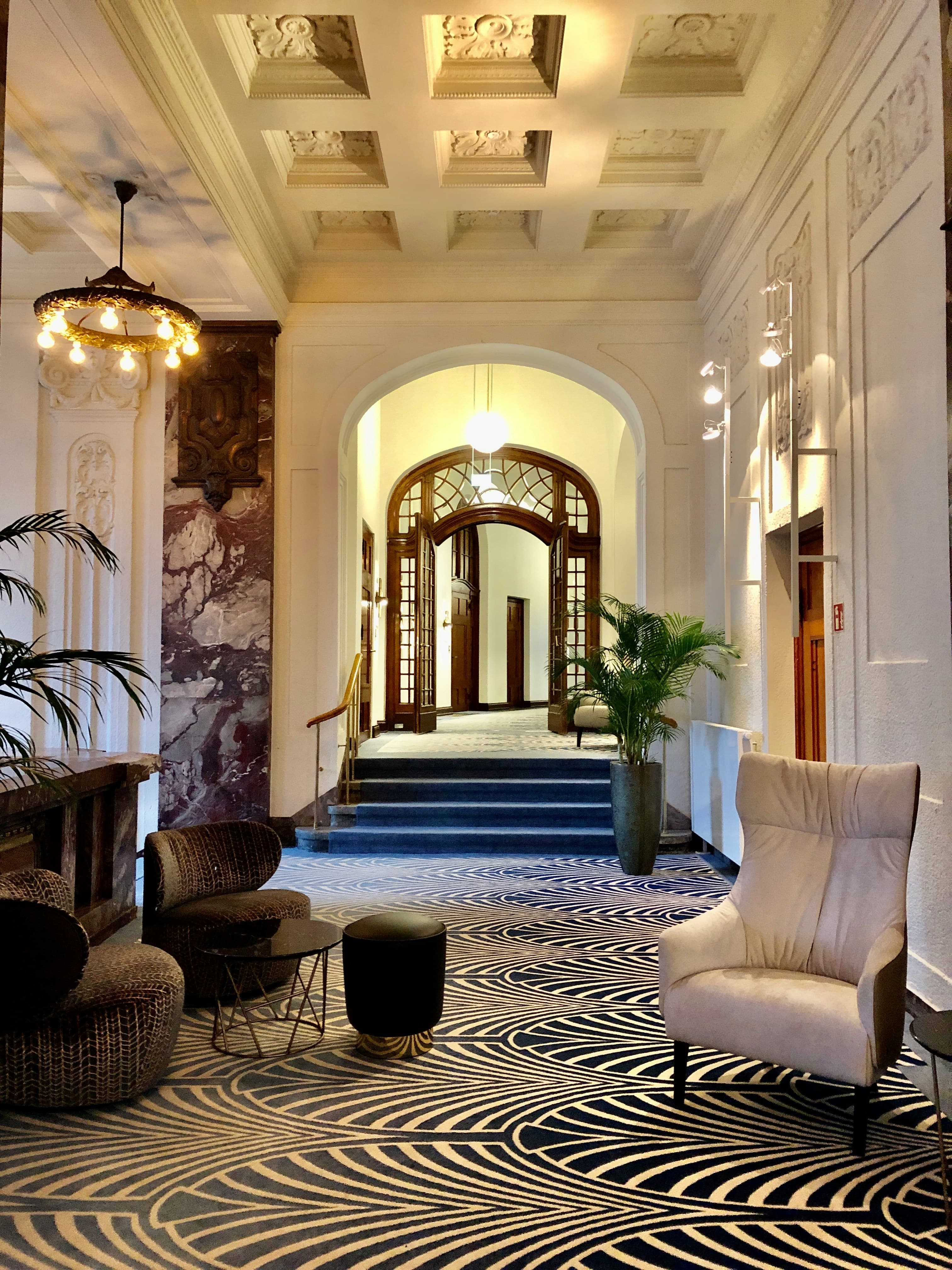 Luxury lobby with freshly cleaned patterned carpet and upholstered seating